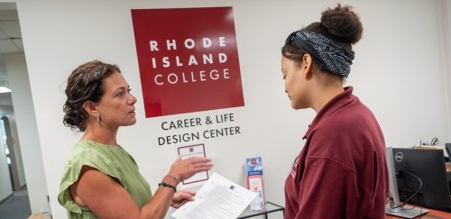 Thea Cerio working with a student in the Career & Life Design Center