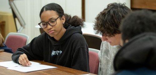 Students working in an artifacts research class