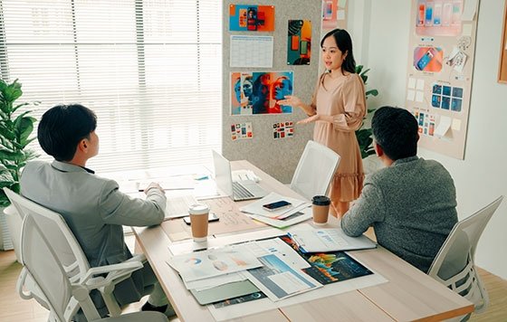 Creative director leading meeting with designers