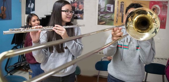 students playing the trombone and flute