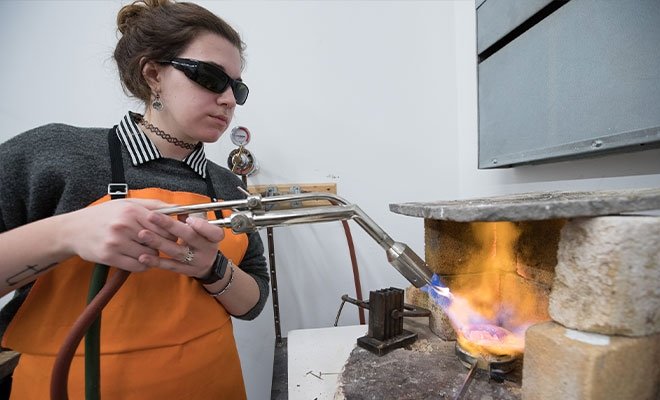 Metalsmith student works on a project