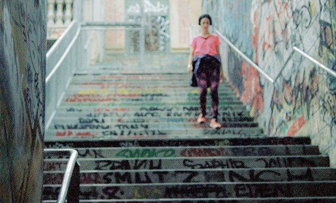 Girl walking down steps