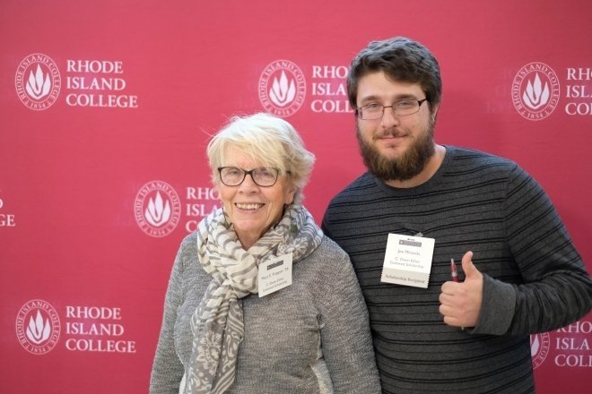 An alum poses with a current student scholarship recipient