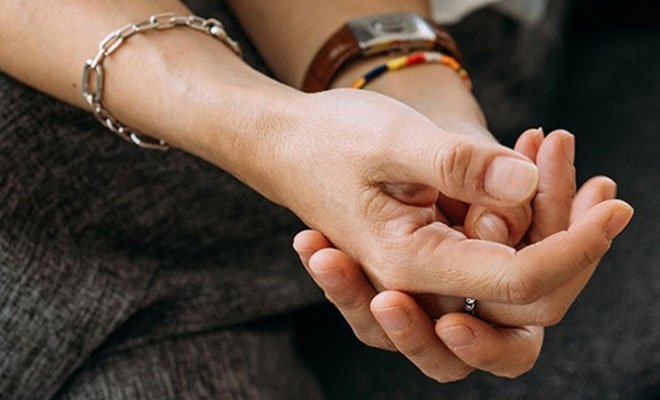 Person holding their own hands