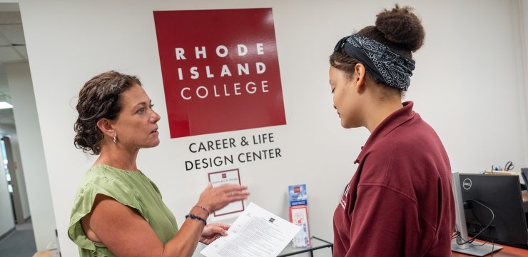 Thea Cerio working with a student in the Career & Life Design Center