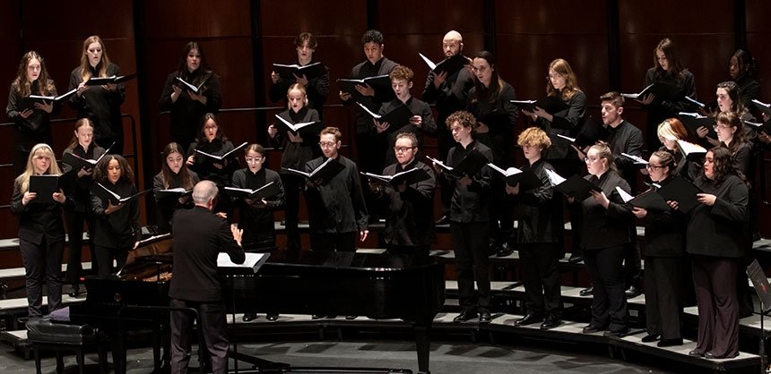 RIC chorus during performance, with director conducting