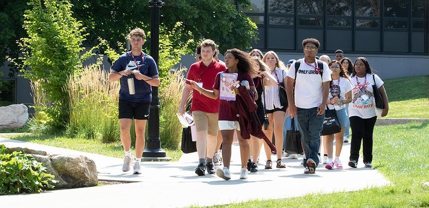 Students on campus tour during the summer, led by student ambassador