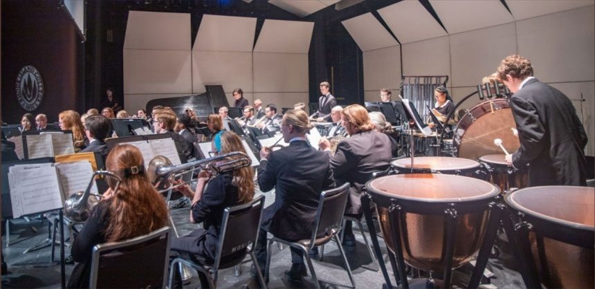 View of RIC Wind Ensemble featuring kettle drum and woodwind instruments